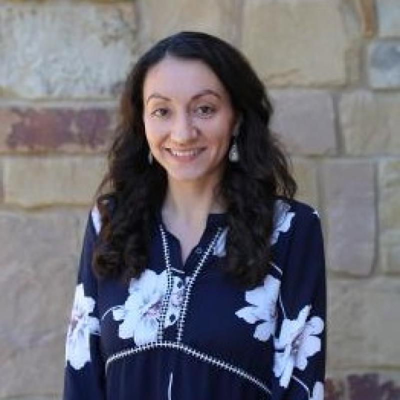Nicole Stein in front of a brick wall